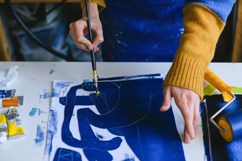 A person experiments with art journaling abstract art