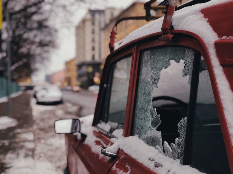 a photo of a broken car window as an illustration of dealing with stress and anxiety