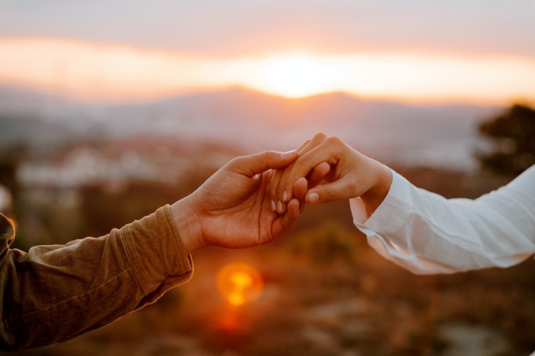 a couple holds hands