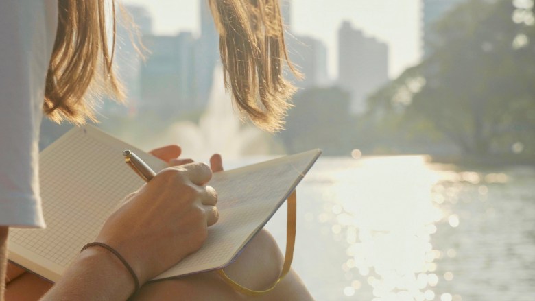 a person journaling about trauma 