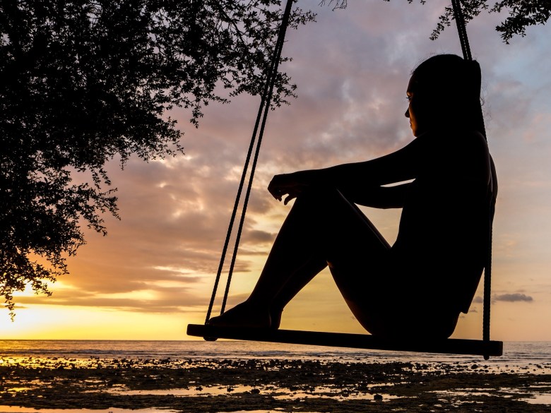 A woman reflects on the scene while traveling 